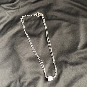 Necklace with faux diamond barrel